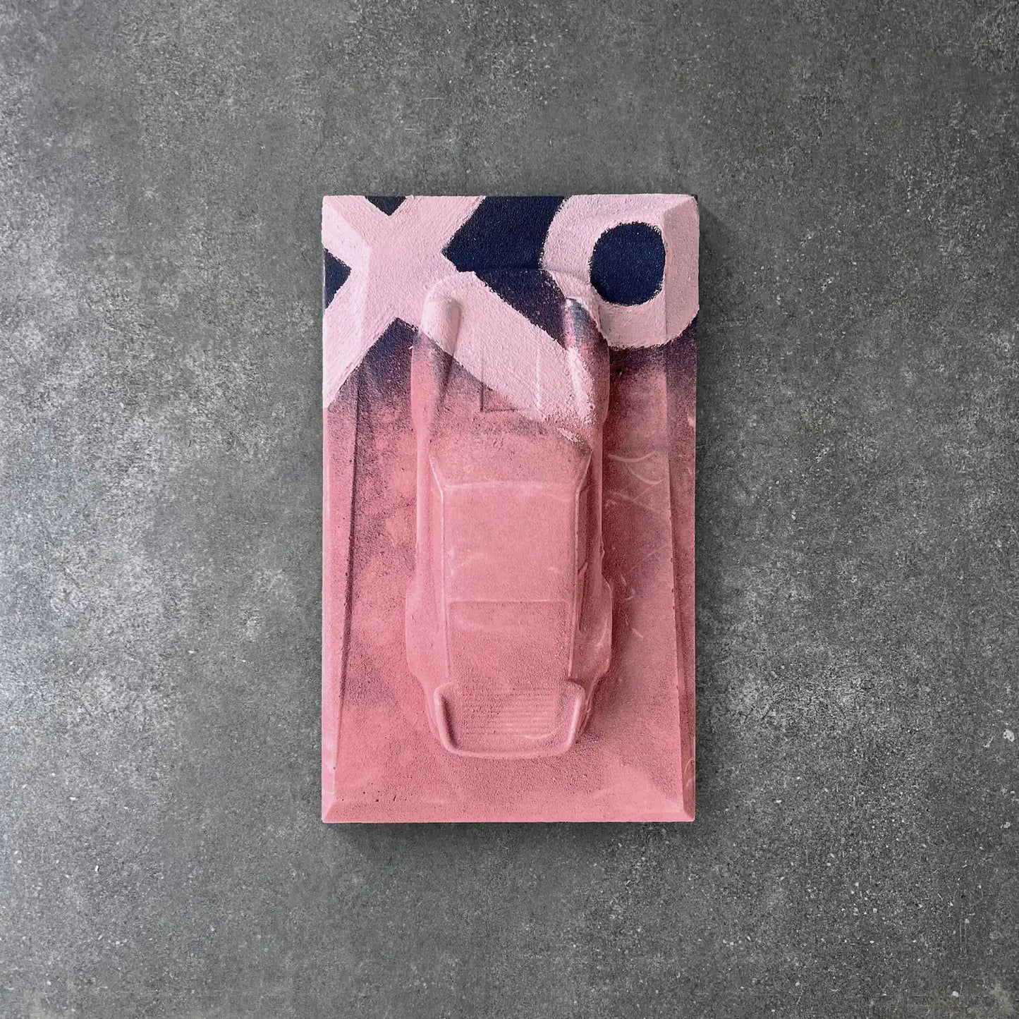Porsche 930 concrete sculpture in pink finish with black and white XO graffiti street art design by CarArt Dubai