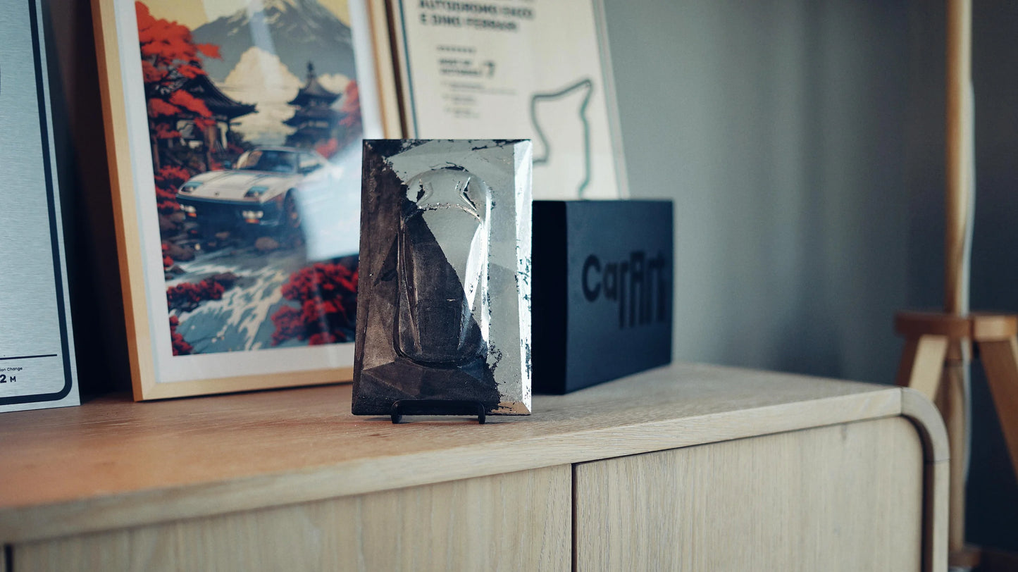 Lotus Emira concrete sculpture mockup in silver-black industrial metallic finish, portrait display by CarArt Dubai