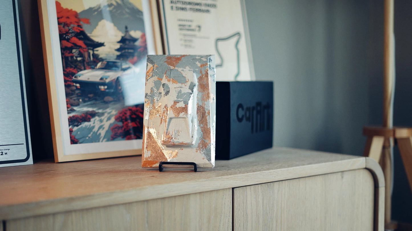 Ferrari 288 GTO concrete sculpture art mockup in silver and copper leaf finish, portrait display by CarArt Dubai