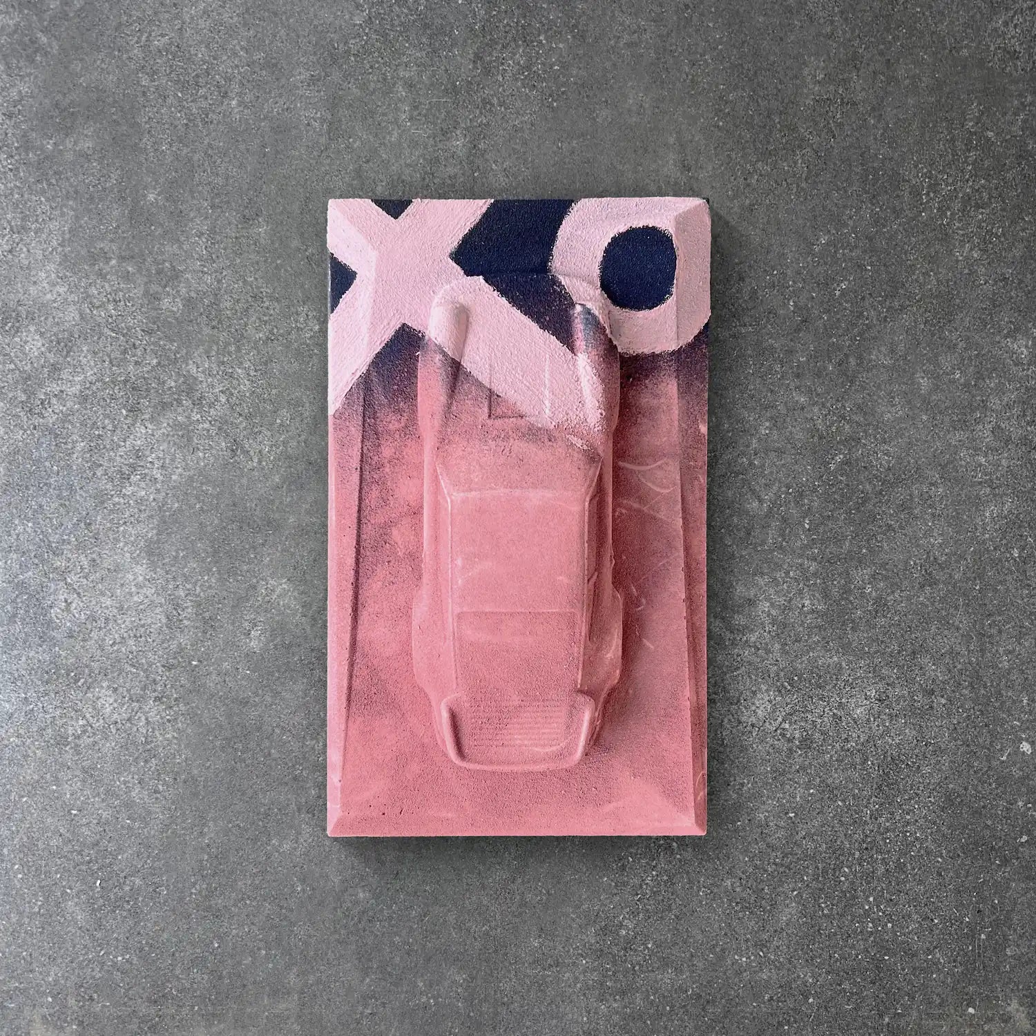 Porsche 930 concrete sculpture in pink finish with black and white XO graffiti street art design by CarArt Dubai