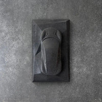Lotus Emira concrete sculpture in deep black raw stone minimal finish by CarArt Dubai