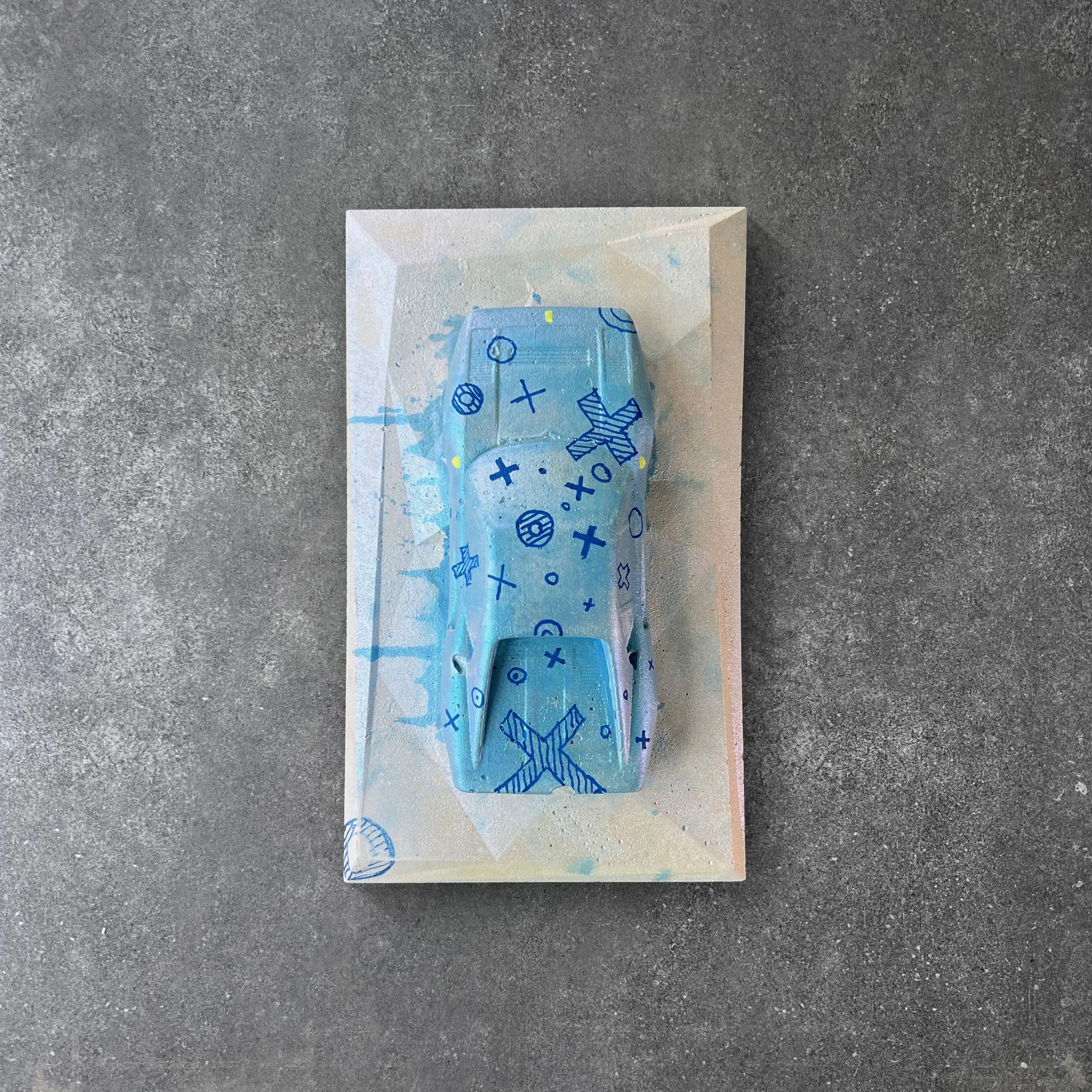 Blue concrete car sculpture with hand-drawn design – CarArt Dubai