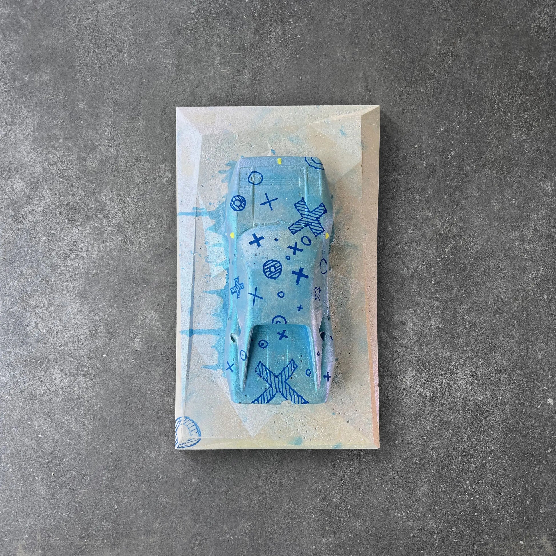 Blue concrete car sculpture with hand-drawn design – CarArt Dubai
