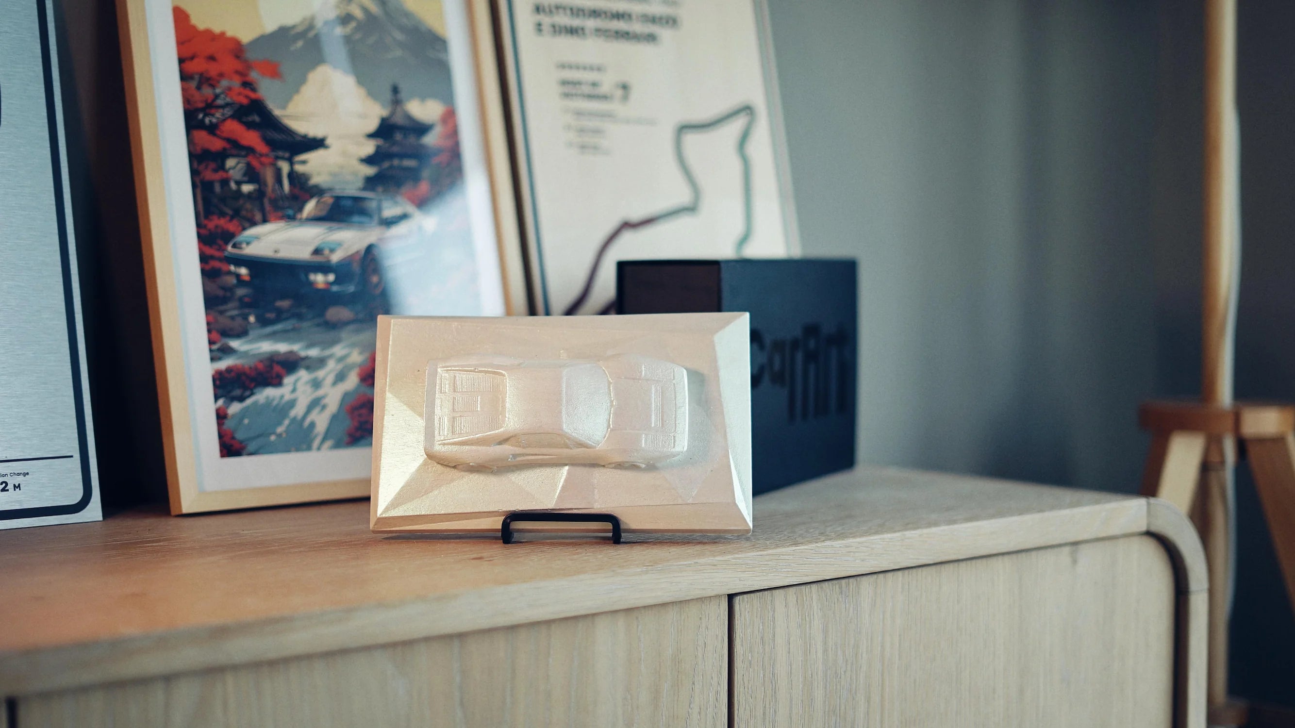 Ferrari 288 GTO concrete sculpture mockup in iridescent pearl shimmering finish, landscape display by CarArt Dubai