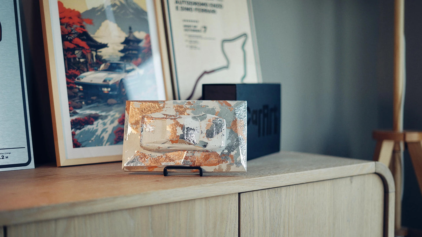 Ferrari 288 GTO concrete sculpture art mockup in silver and copper leaf finish, landscape display by CarArt Dubai