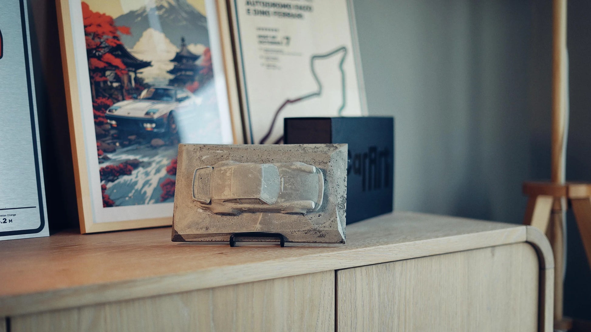 Porsche 930 concrete sculpture in raw textured concrete finish, landscape mockup – CarArt Dubai