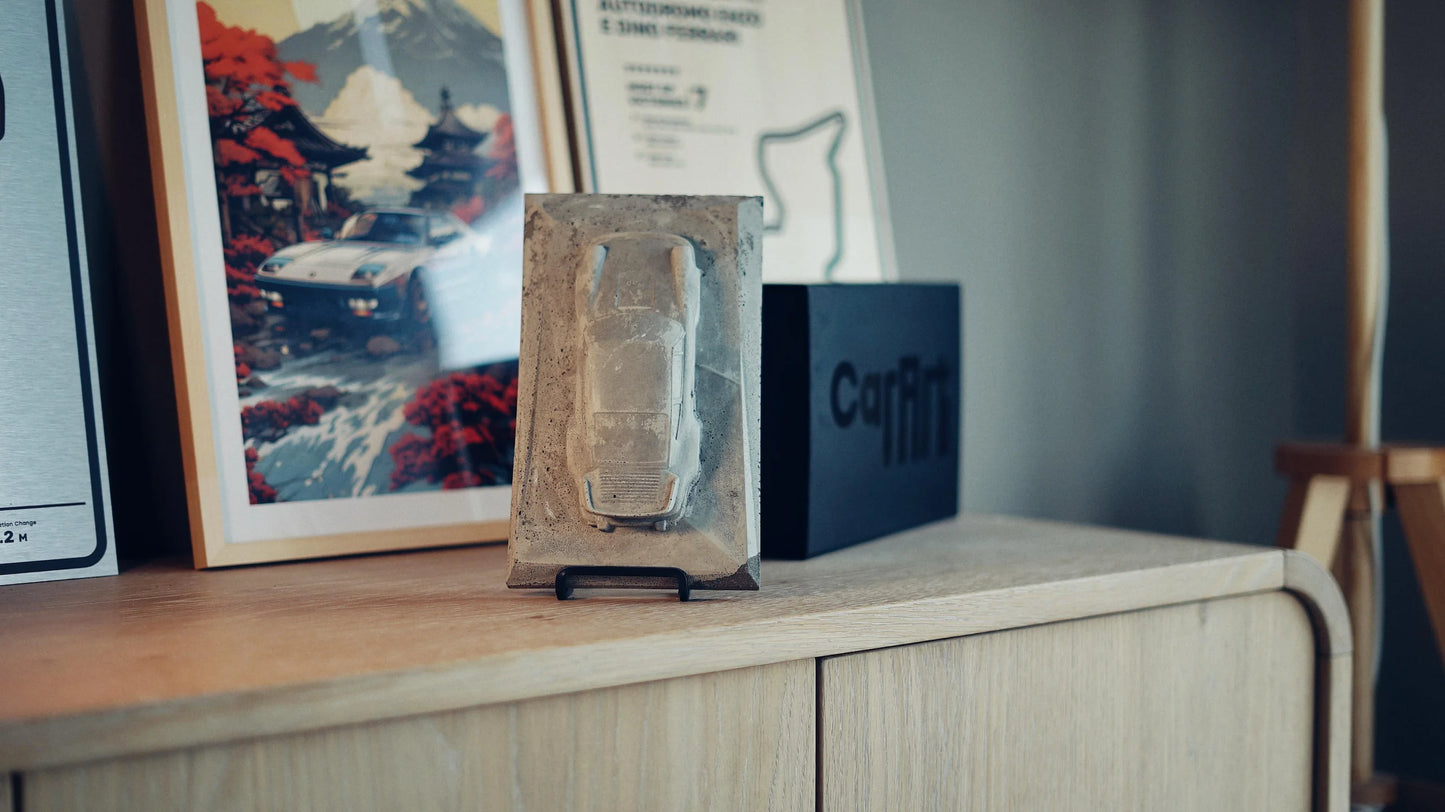 Porsche 930 concrete sculpture in raw textured concrete finish, portrait mockup – CarArt Dubai