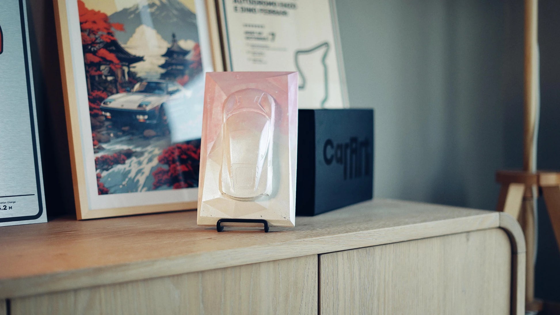 Lotus Emira concrete sculpture in pastel gradient design, portrait mockup – CarArt Dubai